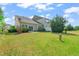 This beautiful backyard has green space and privacy shrubs at 201 Mayfield Dr, Apex, NC 27539