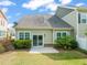 This home has a lovely backyard with a patio, grass, and shrubbery for relaxing and entertaining at 201 Mayfield Dr, Apex, NC 27539