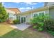 This home has a lovely backyard with a patio, grass, and shrubbery for relaxing and entertaining at 201 Mayfield Dr, Apex, NC 27539