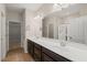 Bathroom featuring double sink vanity, large mirror, and separate shower at 201 Mayfield Dr, Apex, NC 27539