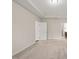 Bedroom with neutral walls and carpet and a door that leads into the bathroom at 201 Mayfield Dr, Apex, NC 27539
