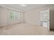 Spacious bedroom with neutral carpet, plantation shutters, and ample natural light at 201 Mayfield Dr, Apex, NC 27539