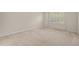Empty bedroom with neutral walls and carpet and a window with plantation shutters at 201 Mayfield Dr, Apex, NC 27539