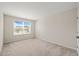 Bright bedroom with plush carpet, and a window that lets in plenty of natural light at 201 Mayfield Dr, Apex, NC 27539