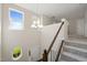 Bright entryway features chandelier lighting, staircase, and natural light from multiple windows at 201 Mayfield Dr, Apex, NC 27539