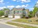 Exterior of a home with a two-car garage and charming landscaping, highlighting its curb appeal at 201 Mayfield Dr, Apex, NC 27539