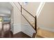 Inviting foyer with a staircase and wood floors, leading to the upper level at 201 Mayfield Dr, Apex, NC 27539