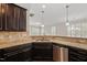 Stylish kitchen featuring granite countertops, tile backsplash, and stainless steel appliances at 201 Mayfield Dr, Apex, NC 27539