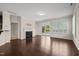 Living room showcasing fireplace, wood floors, and sliding glass door to outside area at 201 Mayfield Dr, Apex, NC 27539