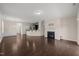 Spacious living area with hardwood floors, an elegant fireplace, and an open layout at 201 Mayfield Dr, Apex, NC 27539