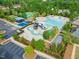 Aerial view of community pool, playground, and tennis courts offer recreational opportunities at 201 Mayfield Dr, Apex, NC 27539