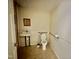Bathroom equipped with accessible features, including a handrail next to the toilet and sink at 211 Webb St, Roxboro, NC 27573