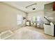 Large, commercial-style kitchen with multiple sinks, stainless steel counters, and ample storage at 211 Webb St, Roxboro, NC 27573