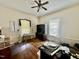 Office with hardwood floors, natural light from two windows, and a ceiling fan at 211 Webb St, Roxboro, NC 27573