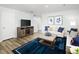 Cozy living room showcasing stylish decor, a plush sofa, and a modern entertainment setup creating a welcoming atmosphere at 254 Elyse Overlook Loop, Sanford, NC 27332