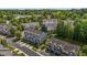 Aerial of a residential neighborhood showing townhomes, parking spaces, and green landscaping at 2713 Wyntercrest Ln, Durham, NC 27713
