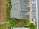 Top-down view of a townhome with assigned parking and some grassy spaces with small trees nearby at 2713 Wyntercrest Ln, Durham, NC 27713