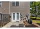Backyard with double doors, patio area, and AC unit at 2713 Wyntercrest Ln, Durham, NC 27713