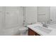 Bathroom featuring a tub, shower, toilet, and single sink with dark wood cabinetry at 2713 Wyntercrest Ln, Durham, NC 27713