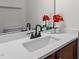 Updated bathroom features a modern vanity with flowers at 2713 Wyntercrest Ln, Durham, NC 27713