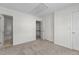 Spare bedroom with neutral carpet, walk-in closet and ensuite bathroom at 2713 Wyntercrest Ln, Durham, NC 27713