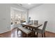 Sunlit dining space with a bay window and stylish furnishings at 2713 Wyntercrest Ln, Durham, NC 27713