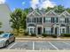 A lovely townhome with neat landscaping, parking, and black shutters for a classic style at 2713 Wyntercrest Ln, Durham, NC 27713
