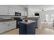 Well-equipped kitchen with white cabinetry and a functional island at 2713 Wyntercrest Ln, Durham, NC 27713
