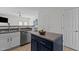 Open kitchen with stainless steel appliances and a central island at 2713 Wyntercrest Ln, Durham, NC 27713