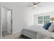Well-lit main bedroom with large window and adjoining bathroom access at 2713 Wyntercrest Ln, Durham, NC 27713