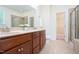Bathroom features double sinks, tile floors, walk-in shower, soaking tub and vanity at 275 N Farm Dr, Clayton, NC 27527