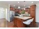 Modern kitchen featuring an island with granite countertops and stainless steel appliances at 275 N Farm Dr, Clayton, NC 27527