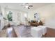 Cozy living room with fireplace, lots of light, and comfortable seating arrangements at 275 N Farm Dr, Clayton, NC 27527
