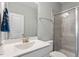 Modern bathroom features a glass-enclosed shower, sink, and neutral color palette at 2919 Winter Crop Way, Apex, NC 27502