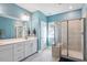 Modern bathroom featuring double sinks, a glass-enclosed shower, and bright lighting at 2919 Winter Crop Way, Apex, NC 27502