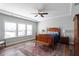 Traditional bedroom featuring hardwood floors and a ceiling fan at 2919 Winter Crop Way, Apex, NC 27502