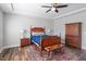 Bedroom with wooden furniture, patterned rug and ample natural light at 2919 Winter Crop Way, Apex, NC 27502