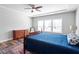 Spacious bedroom featuring a fan, hardwood floors and furniture at 2919 Winter Crop Way, Apex, NC 27502