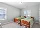 Bedroom featuring two twin beds with decorative pillows at 2919 Winter Crop Way, Apex, NC 27502