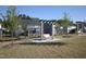 Outdoor seating area with wooden benches and pergola and mature trees and community walking path at 2919 Winter Crop Way, Apex, NC 27502