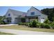 Community center building with black and white trim and an outdoor patio at 2919 Winter Crop Way, Apex, NC 27502