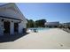 Outdoor community pool area with bathhouse and lounge chairs at 2919 Winter Crop Way, Apex, NC 27502