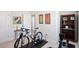 A clean exercise room with a bicycle and machine for home fitness at 2919 Winter Crop Way, Apex, NC 27502