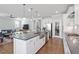 Open kitchen with island, stainless steel appliances, and modern design at 2919 Winter Crop Way, Apex, NC 27502