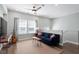 Living area features hardwood flooring, fan and lots of natural light at 2919 Winter Crop Way, Apex, NC 27502