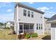 Home's rear exterior with a screened porch, offering a comfortable outdoor living space at 2919 Winter Crop Way, Apex, NC 27502