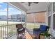 Inviting screened porch with comfortable seating, ceiling fan, and views of the neighborhood at 2919 Winter Crop Way, Apex, NC 27502
