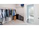 Walk-in closet featuring a view to the bathroom at 2919 Winter Crop Way, Apex, NC 27502