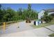 Community walking path with bike racks, recycling, and green space and mature landscaping in the community at 2919 Winter Crop Way, Apex, NC 27502