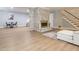 Open basement area featuring a white-painted brick fireplace with seating and a small table at 3009 Hillmer Dr, Raleigh, NC 27609